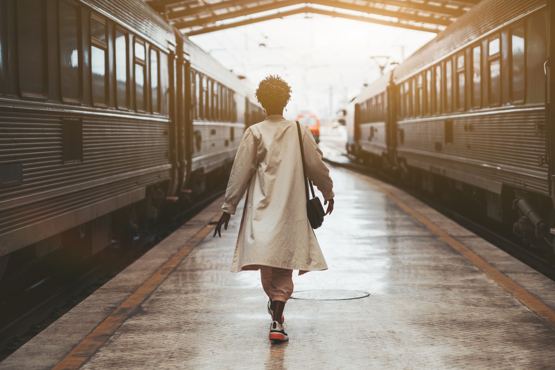 Black girl between two trains